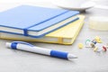 Blue plastic ball pen with office supplies Royalty Free Stock Photo