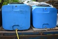 Blue plastic barrels for drinking water, liquid storage tanks Royalty Free Stock Photo