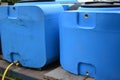 Blue plastic barrels for drinking water, liquid storage tanks Royalty Free Stock Photo
