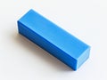 A blue plastic block on a white surface Royalty Free Stock Photo
