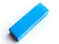 A blue plastic block on a white surface Royalty Free Stock Photo