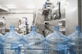 Blue plastic bottles on automated conveyor line or belt on pure water factory Royalty Free Stock Photo