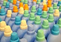 Blue plastic bottles with colorful caps for home care and hygiene in a supermarket shelf. Royalty Free Stock Photo