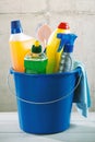 Blue plastic bucket filled with cleaning supplies Royalty Free Stock Photo