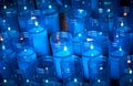 Blue plastic candles of a sanctuary with selective focus and copy space for text Royalty Free Stock Photo