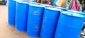 Blue plastic gallons full of various flammable waste at the recycling center Royalty Free Stock Photo