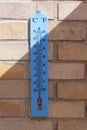 Blue Plastic Garden Thermometer showing High Temperature Royalty Free Stock Photo