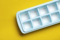 Blue plastic mold for making ice cubes for use in cocktails. Space for text Royalty Free Stock Photo