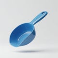 Blue plastic scoop with a contoured, ergonomic handle Royalty Free Stock Photo