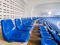 Blue plastic seat rows at the stadium.