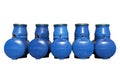 Blue plastic septic tanks are standing. Five cylindrical containers in a row. Isolated white background, a large of sewage