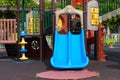 Plastic slide on empty multicolored playground