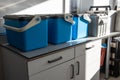 Blue plastic storage boxes on a laboratory counter.Automatic sampler equipment in laboratory setting Royalty Free Stock Photo