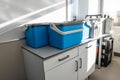 Blue plastic storage boxes on a laboratory counter.Automatic wastewater sampler equipment in laboratory setting Royalty Free Stock Photo