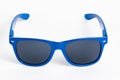 Blue plastic sunglasses isolated on white Royalty Free Stock Photo