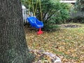 Blue plastic swing for child hanging on a tree Royalty Free Stock Photo