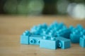 Blue of plastic toy blocks on wood table Royalty Free Stock Photo