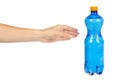 Blue plastic water bottle with orange cap, isolated on white background, with hand Royalty Free Stock Photo