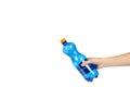 Blue plastic water bottle with orange cap, isolated on white background, with hand, copy space template Royalty Free Stock Photo