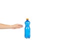 Blue plastic water bottle with orange cap, isolated on white background, with hand, copy space template Royalty Free Stock Photo