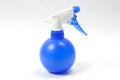 Blue plastic water sprayer on white background. Royalty Free Stock Photo