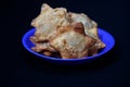 A blue plate features Aloo Puff Pastry accompanied by tomato sauce for dipping Royalty Free Stock Photo