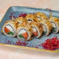 Blue Plate With Sushi and Vegetables Royalty Free Stock Photo