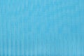 Blue pleated transparent caprone cloth as background texture