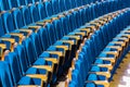 Blue plush chairs with wooden armrests in the auditorium. Empty auditorium in the theater Royalty Free Stock Photo