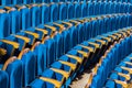 Blue plush chairs with wooden armrests in the auditorium. Empty auditorium in the theater Royalty Free Stock Photo