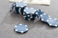 Blue poker chips on stock market chart background Royalty Free Stock Photo