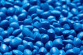 Blue polymer dye in granules, background texture Royalty Free Stock Photo