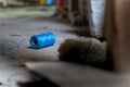 Blue polypropylene construction thread lies on the floor at a construction site close-up. Blue twine thread