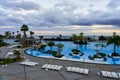 Blue pool on the background of the ocean during sunset. A tourist place of rest and leisure