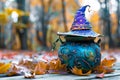 A blue pot with a purple witch hat sitting on top of it Royalty Free Stock Photo