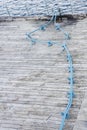 Blue Potable Water Hose Running Across Pier