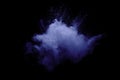 Blue powder explode cloud on black background.Launched blue dust particles splash on background Royalty Free Stock Photo