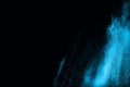 Blue powder explosion on black background. Royalty Free Stock Photo