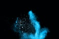 Blue powder explosion on black background. Royalty Free Stock Photo