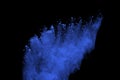 Blue powder explosion on black background. Colored cloud. Color dust explode. Paint Holi.