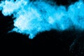Blue powder explosion on white background. Royalty Free Stock Photo