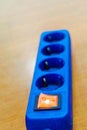 Blue power strip with orange switch Royalty Free Stock Photo