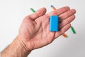 Blue PP3 battery in male hand on white background. Accumulator Royalty Free Stock Photo