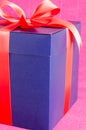 Blue present box with red ribbon isolated Royalty Free Stock Photo