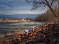 Blue primroses on the hillside and ancient Maltese castle. Spring sunny landscape in the ancient Russian city of Gatchina Royalty Free Stock Photo