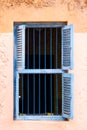 Blue Prison Bars And Wooden Louvred Shutters Royalty Free Stock Photo