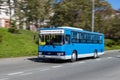 A blue public transport bus running in Petropavlovsk-Kamchatskiy, Russia.