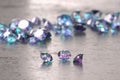 Blue and Purple diamonds placed on glossy background, 3D illustration, selective focus