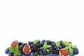 Blue and purple food. Ripe blueberries, blackberries, grapes, plums and figs. Royalty Free Stock Photo