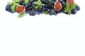 Blue and purple food. Ripe blueberries, blackberries, grapes, plums and figs. Top view with copy space. Royalty Free Stock Photo